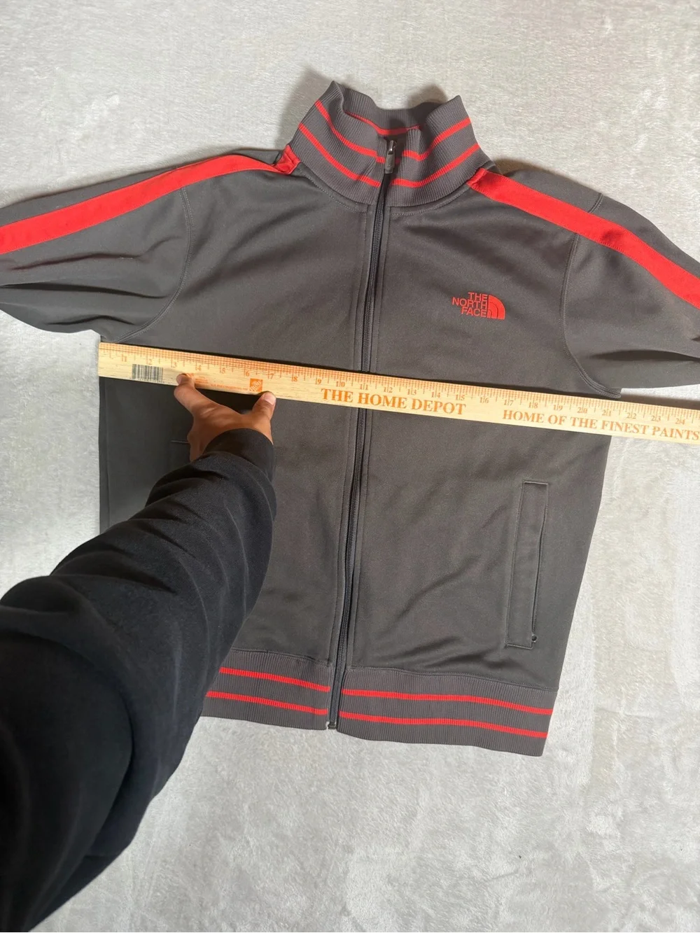 The North Face Black Jacket with Red Stripe Accents
